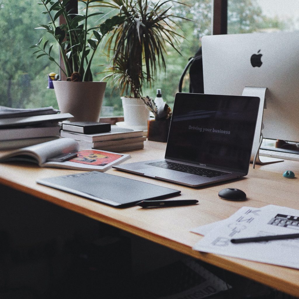 A laptop sitting on the desk of a remote worker